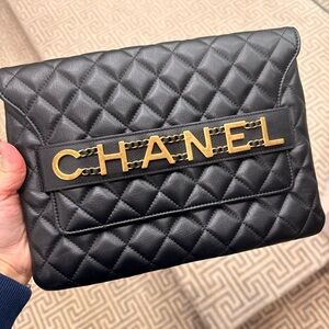 SOLD CHANEL Black Quilted Clutch with Gold Lettering